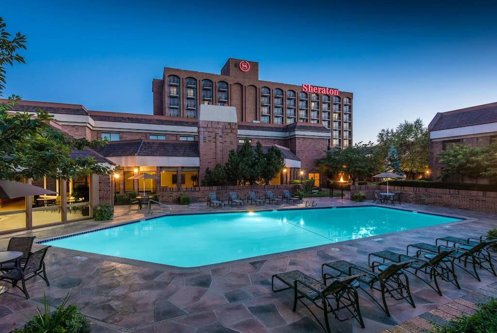 Sheraton Salt Lake City Hotel building with pool at night